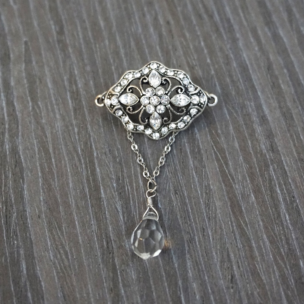 Silver-Toned Rhinestone Brooch with Dangle Embellishment